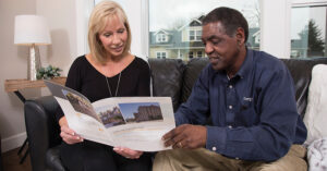 contractor and homeowner looking at paper