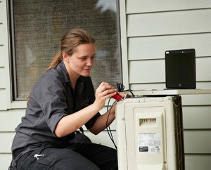 women working on a device