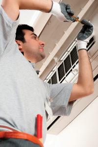 a workman installing a wall mounted device