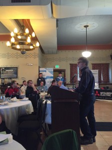 a man speaking at a podium