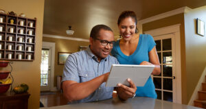 Man and woman looking at a tablet