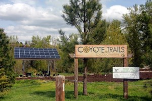 solar panels next to a trail head