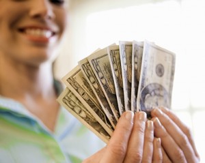 women hold eight twenty dollar bills
