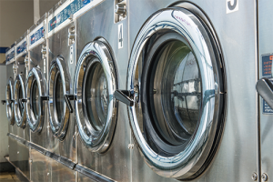 a line up of silver laundry machines