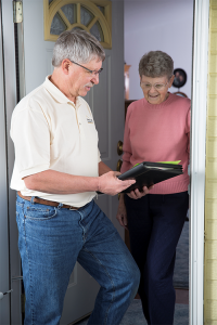 a building professional going through information with a homeowner